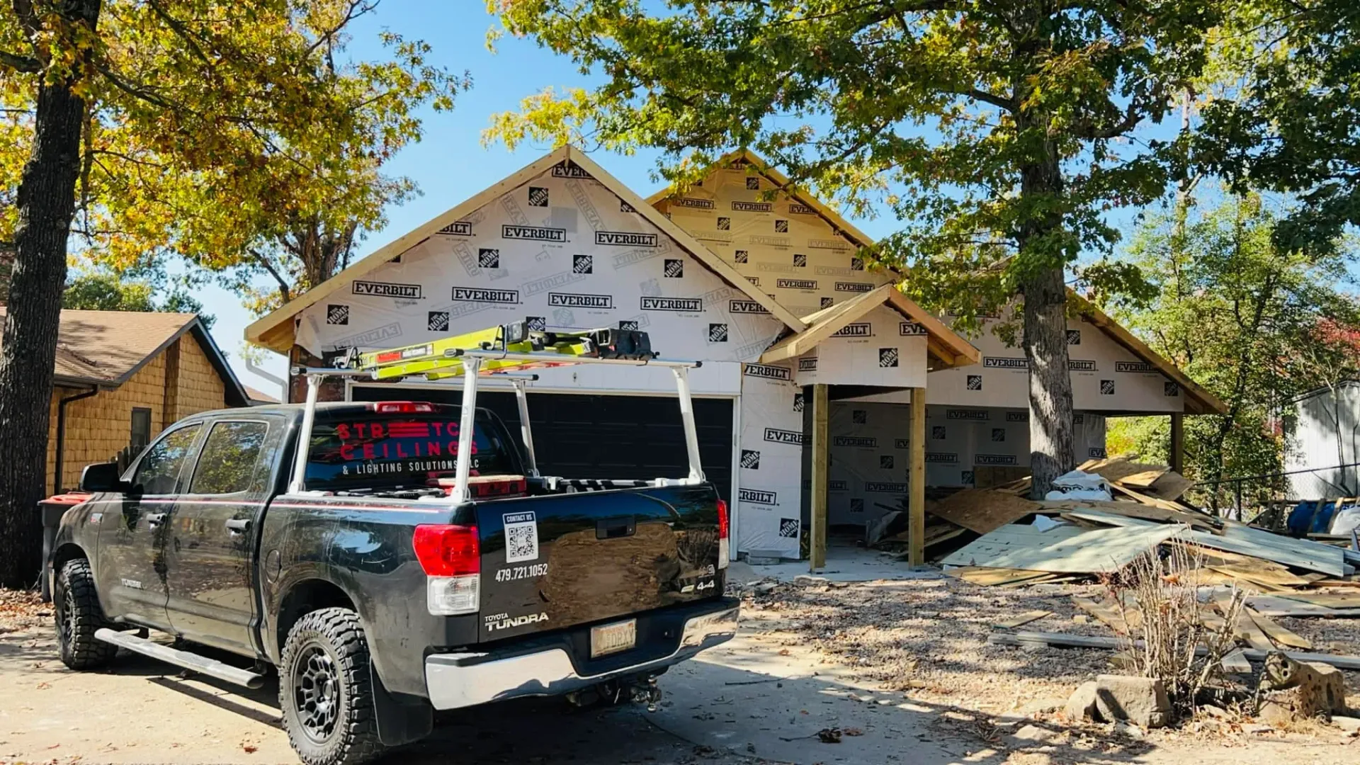 Company  truck parked in front job site in Arkansas home 