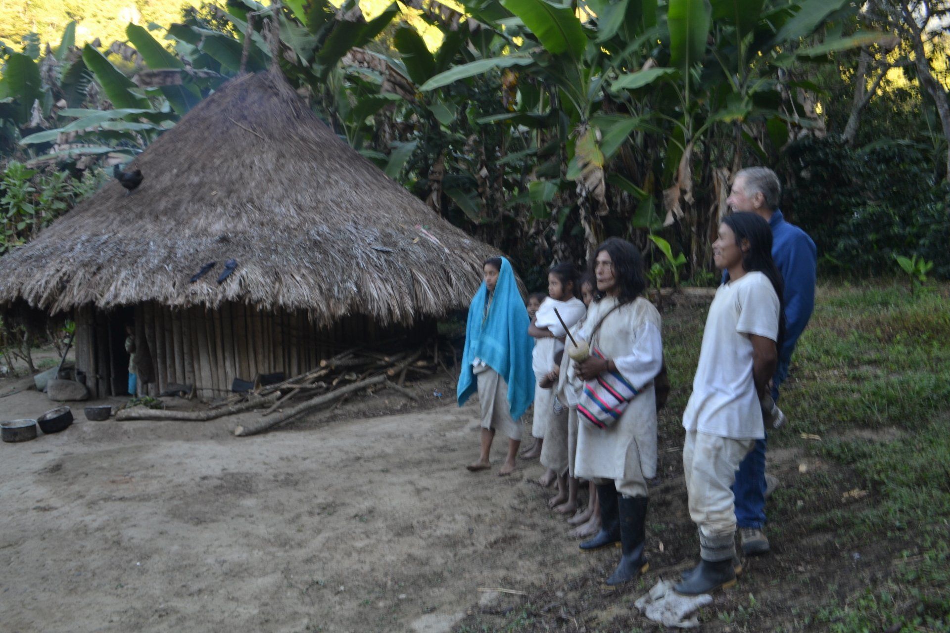 gerry, members of the Kogi tribe outside a Kogi hut