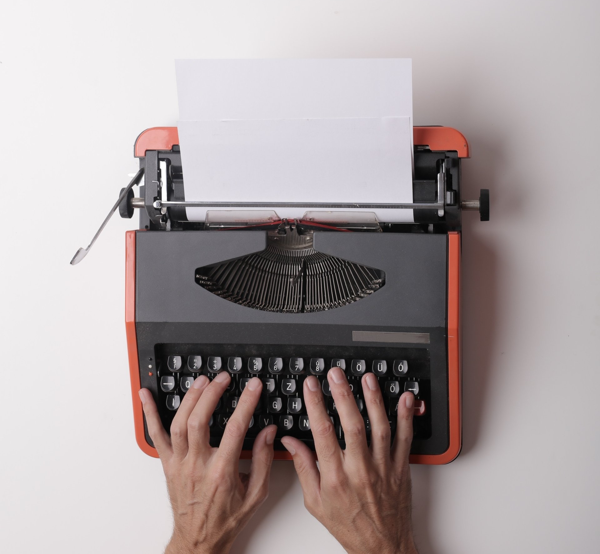 typewriter with two hands