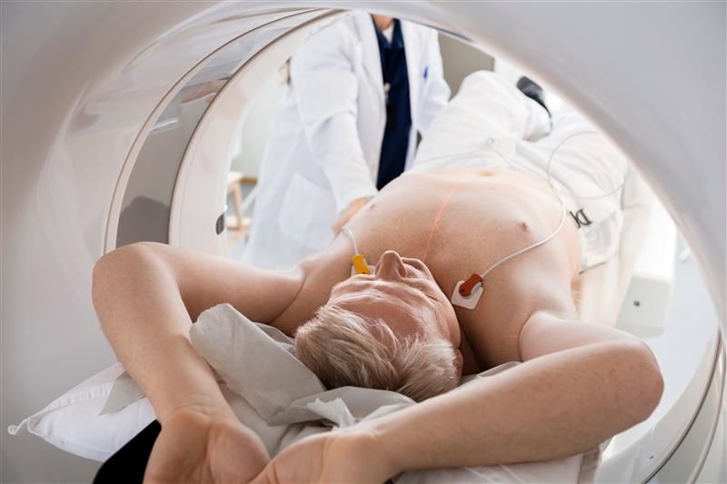 A man is getting a heart CT scan.