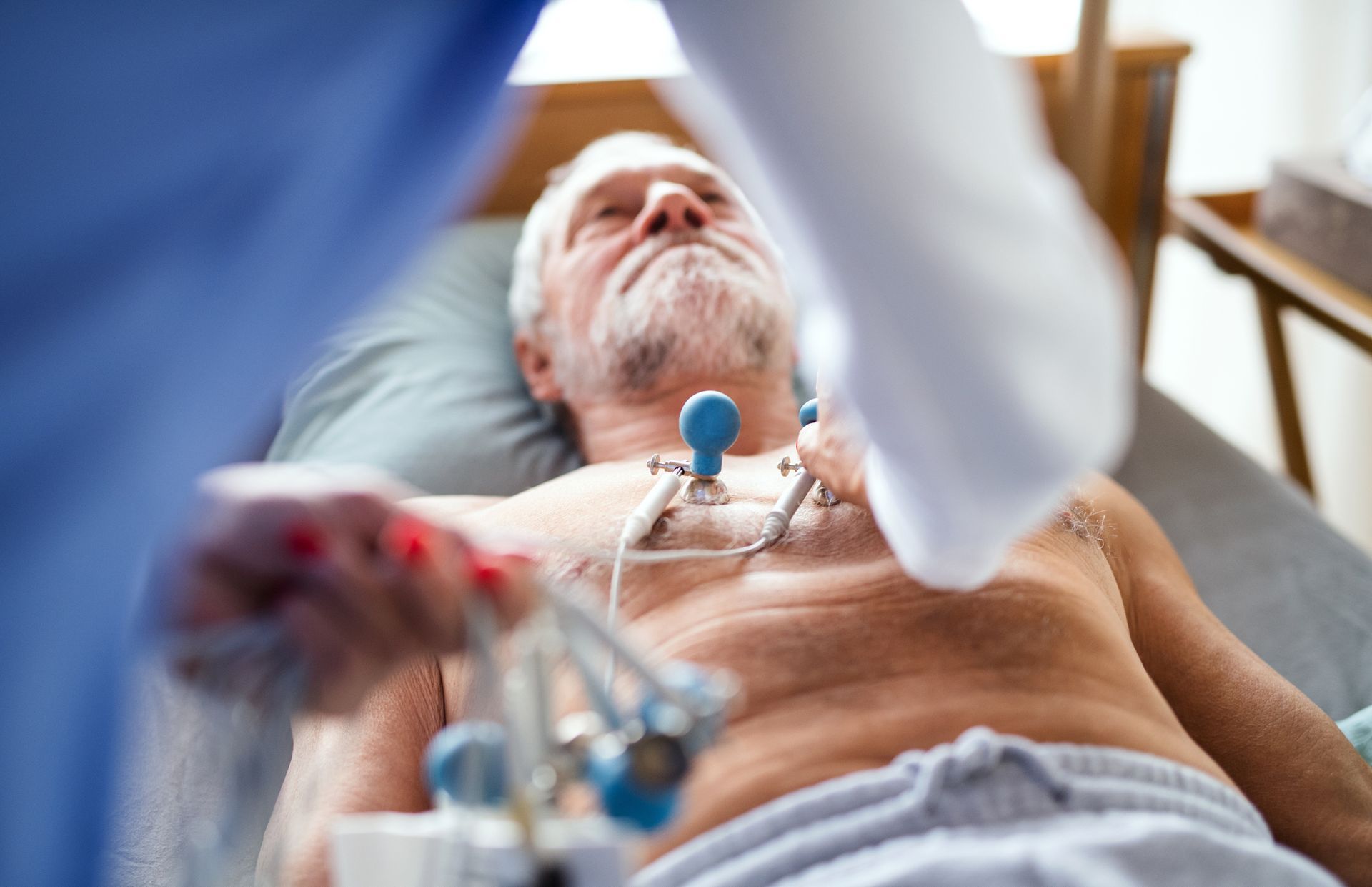 Senior patient undergoing EKG testing with a trusted cardiology specialist.