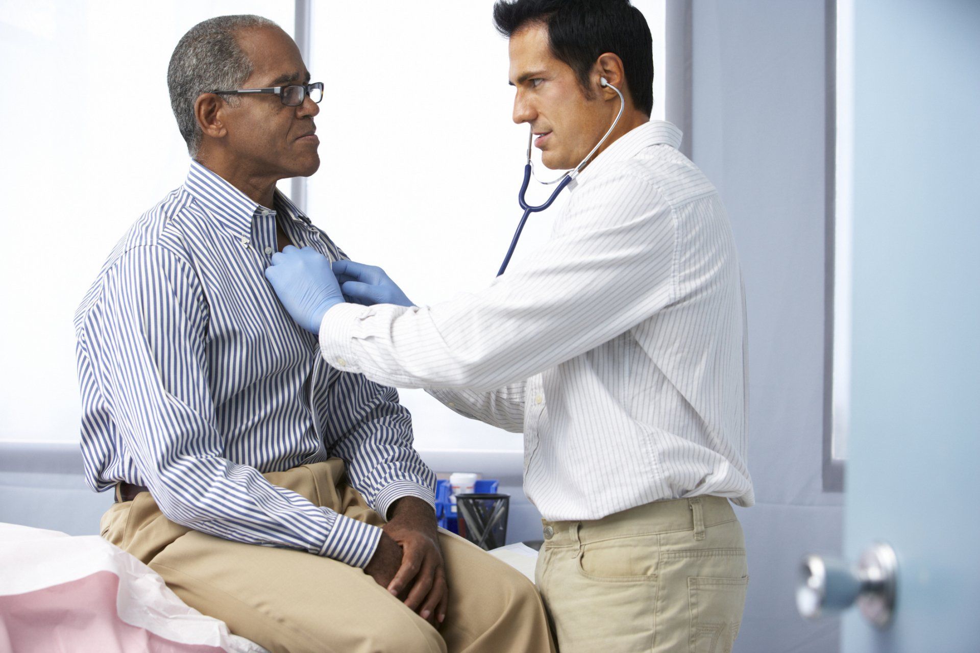 Doctor checking male senior — Fort Wayne, IN — Allen County Cardiology