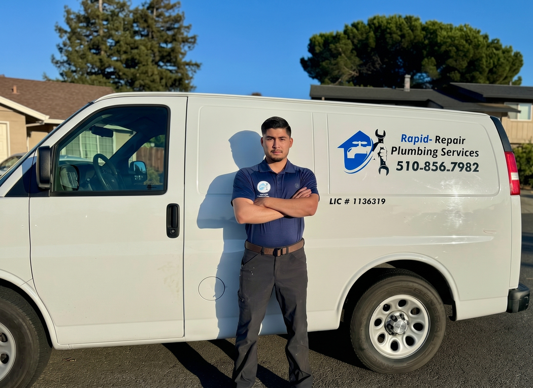 Plumbing service van with technician standing beside it in a residential street
