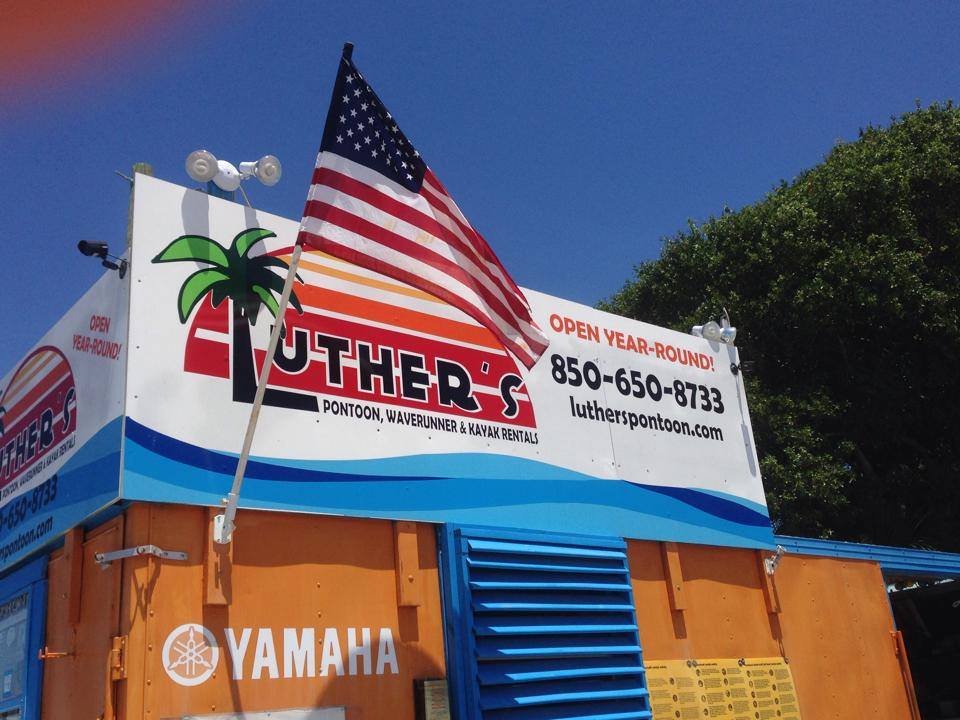 Luther's Pontoon WaveRunner & Kayak Rentals sign in Destin FL