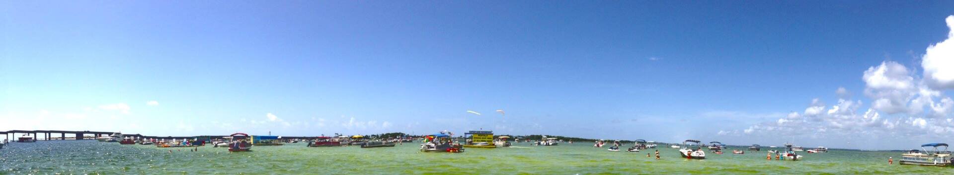Large group of boats anchored at Crab Island in Destin FL