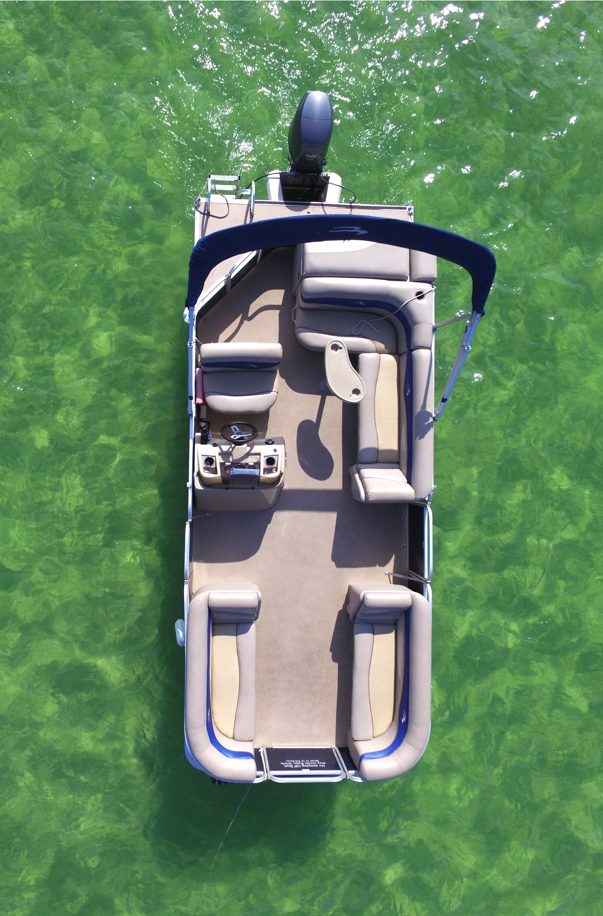 Aerial image of blue pontoon boat rental from Luther's Pontoon Rentals in Destin FL