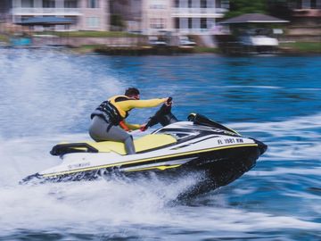 Man riding a yellow Yamaha WaveRunner Jet Ski