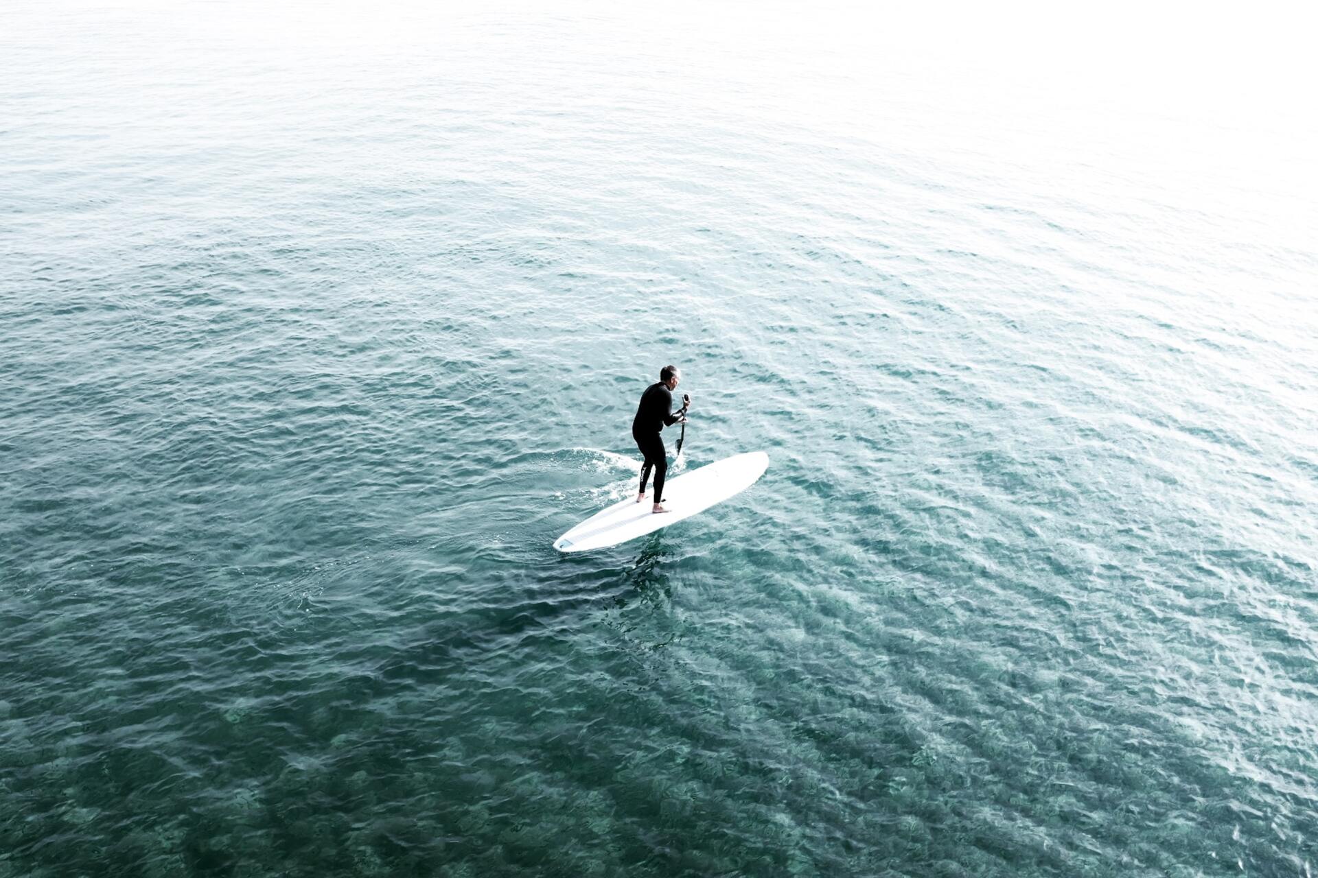 man on stand-up paddleboard rental in Destin FL