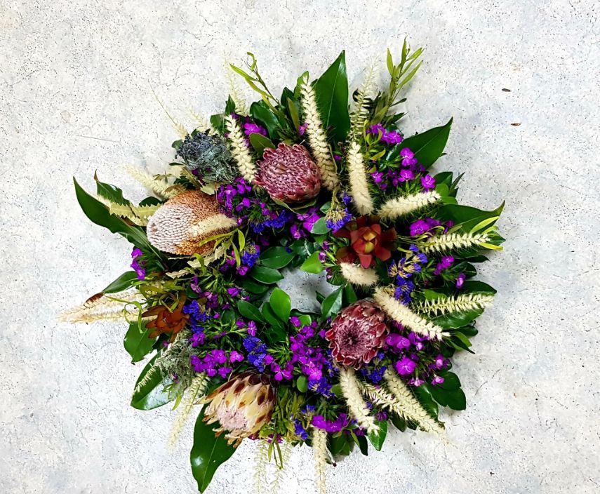A Wreath With Purple and White Flowers and Green Leaves — Greenfield Blooms and Gifts In Wanguri, NT