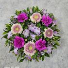 A wreath of purple and white flowers with green leaves — Greenfield Blooms and Gifts In Wanguri, NT