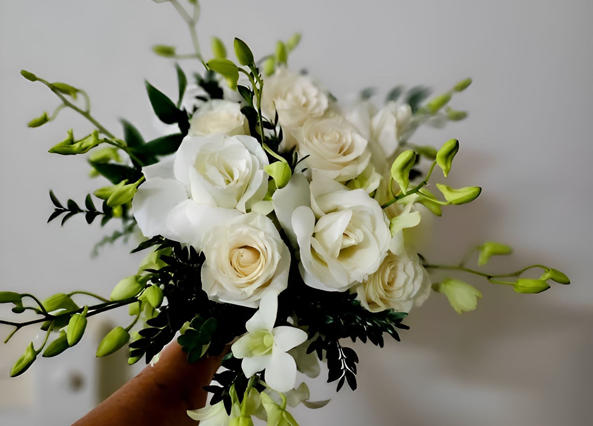 A Person is Holding a Bouquet of White Flowers — Greenfield Blooms and Gifts In Wanguri, NT
