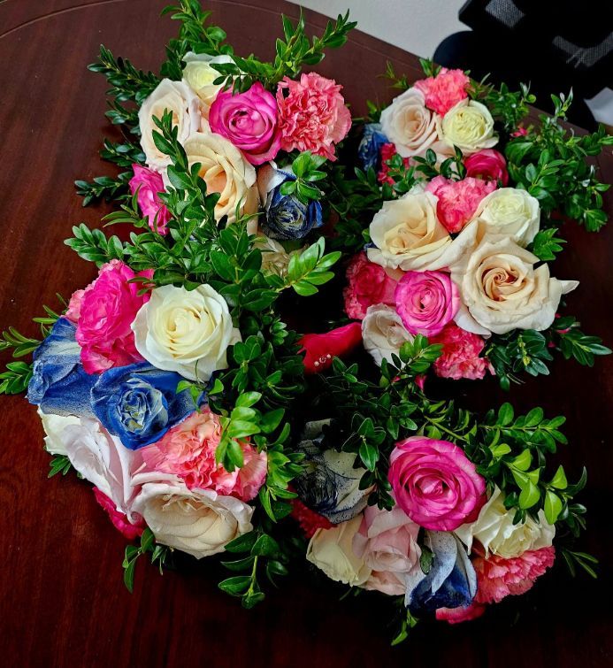 A Bunch of Colourful Flowers on a Wooden Table — Greenfield Blooms and Gifts In Wanguri, NT