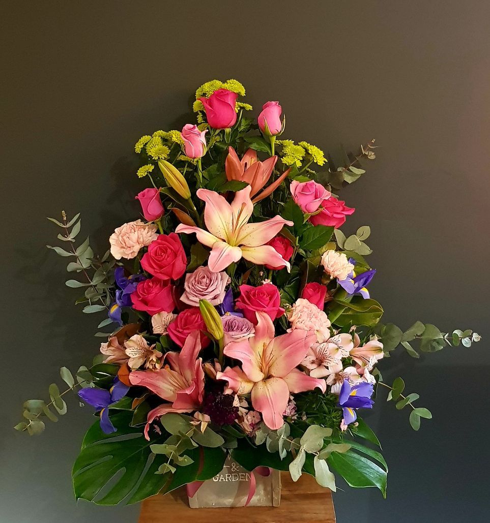A Vase Filled With Pink Roses, Lilies, and Other Flowers — Greenfield Blooms and Gifts In Wanguri, NT