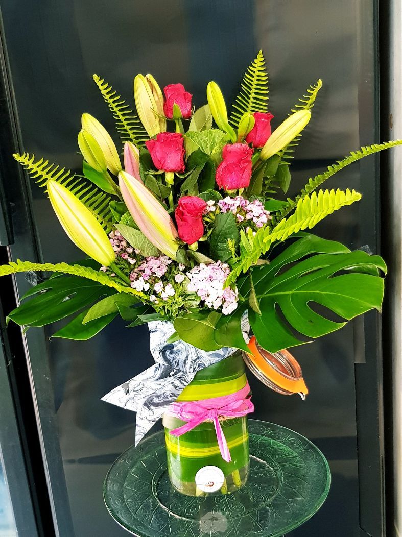 A Yellow Box Filled With Flowers is Sitting on the Ground — Greenfield Blooms and Gifts In Wanguri, NT