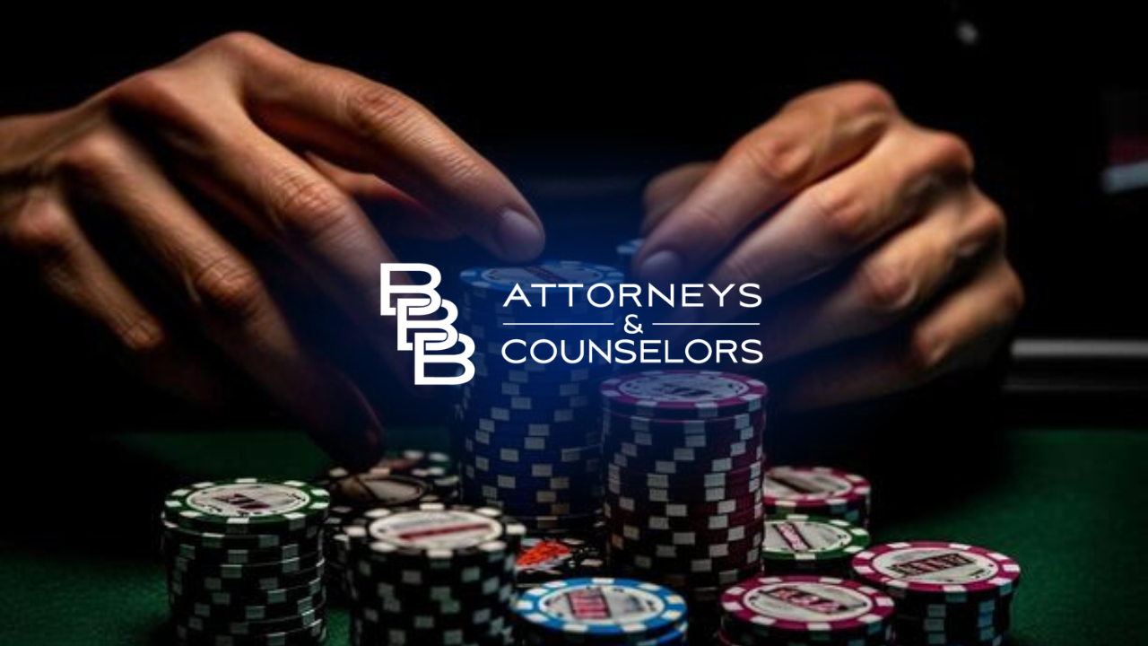 Hands arranging poker chips around an “ATTORNEYS & COUNSELORS” logo on a dark background