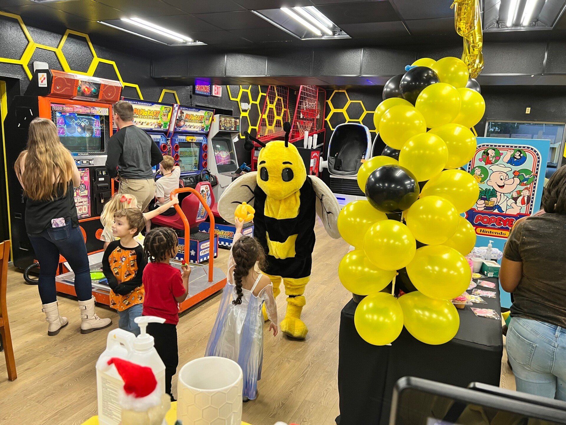 Picture Of Bee Mascot With Childrens - Niceville, FL - Honeybee Ice Cream & Arcade