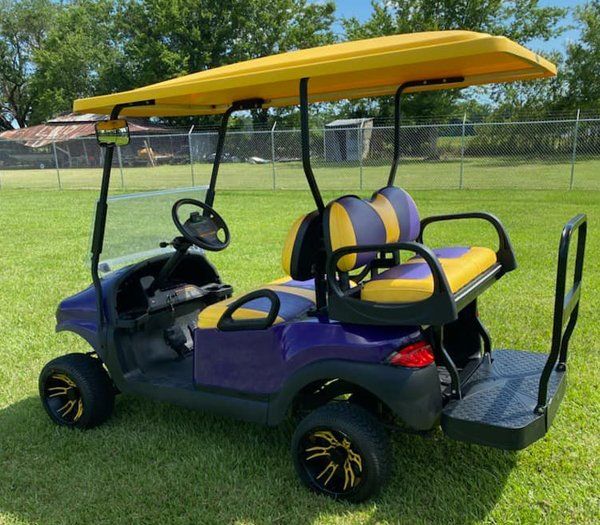 Yellow and purple themed golf cart
