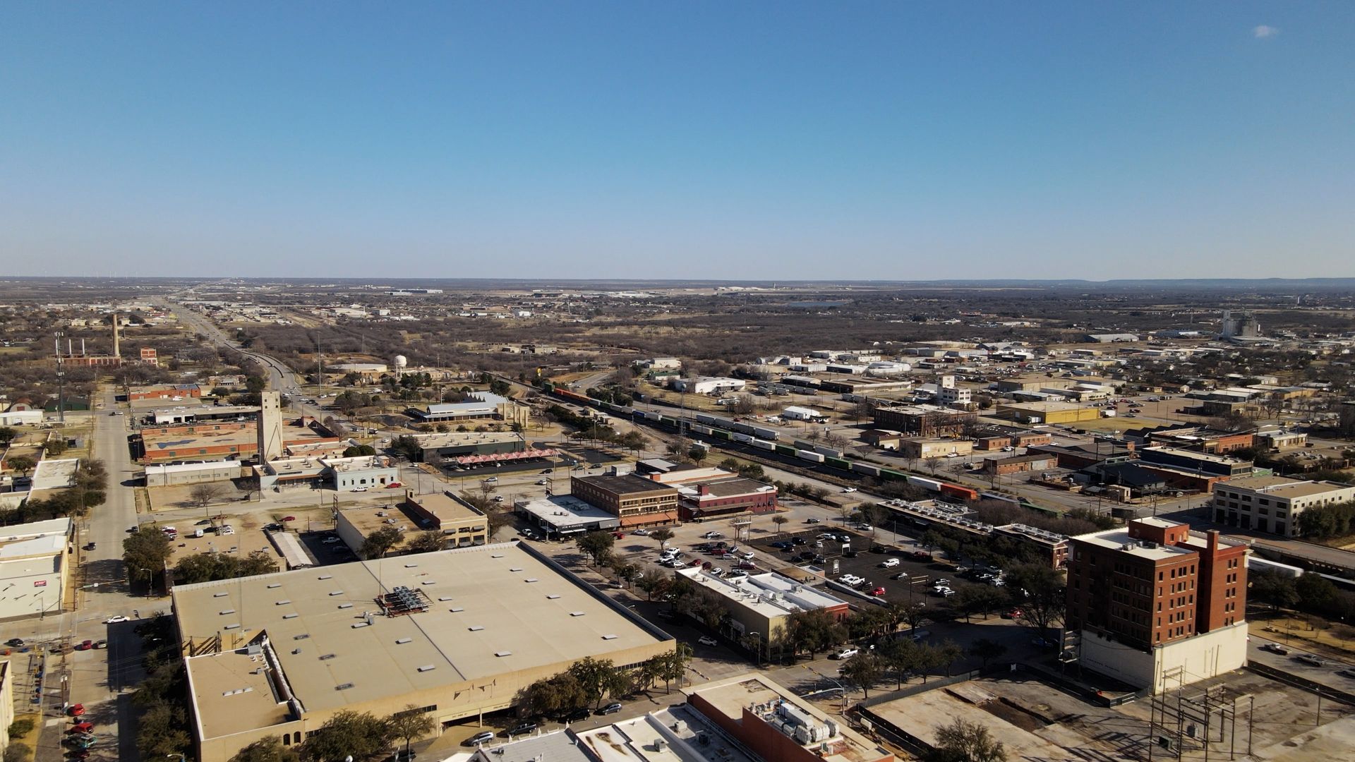An aerial view of a city on a sunny day