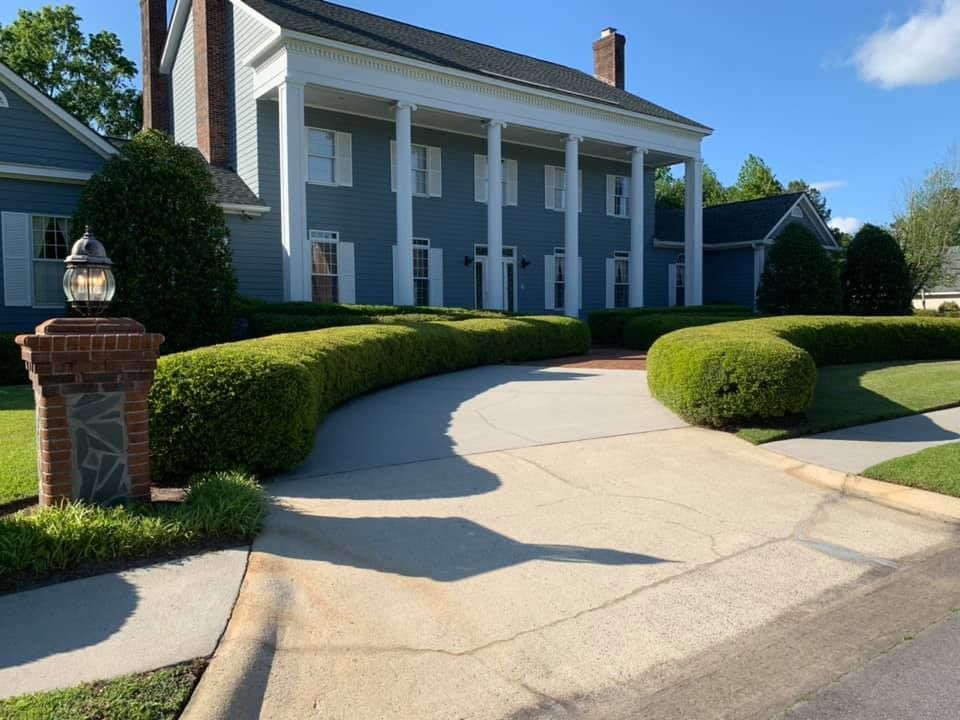 A large house with a driveway leading to it