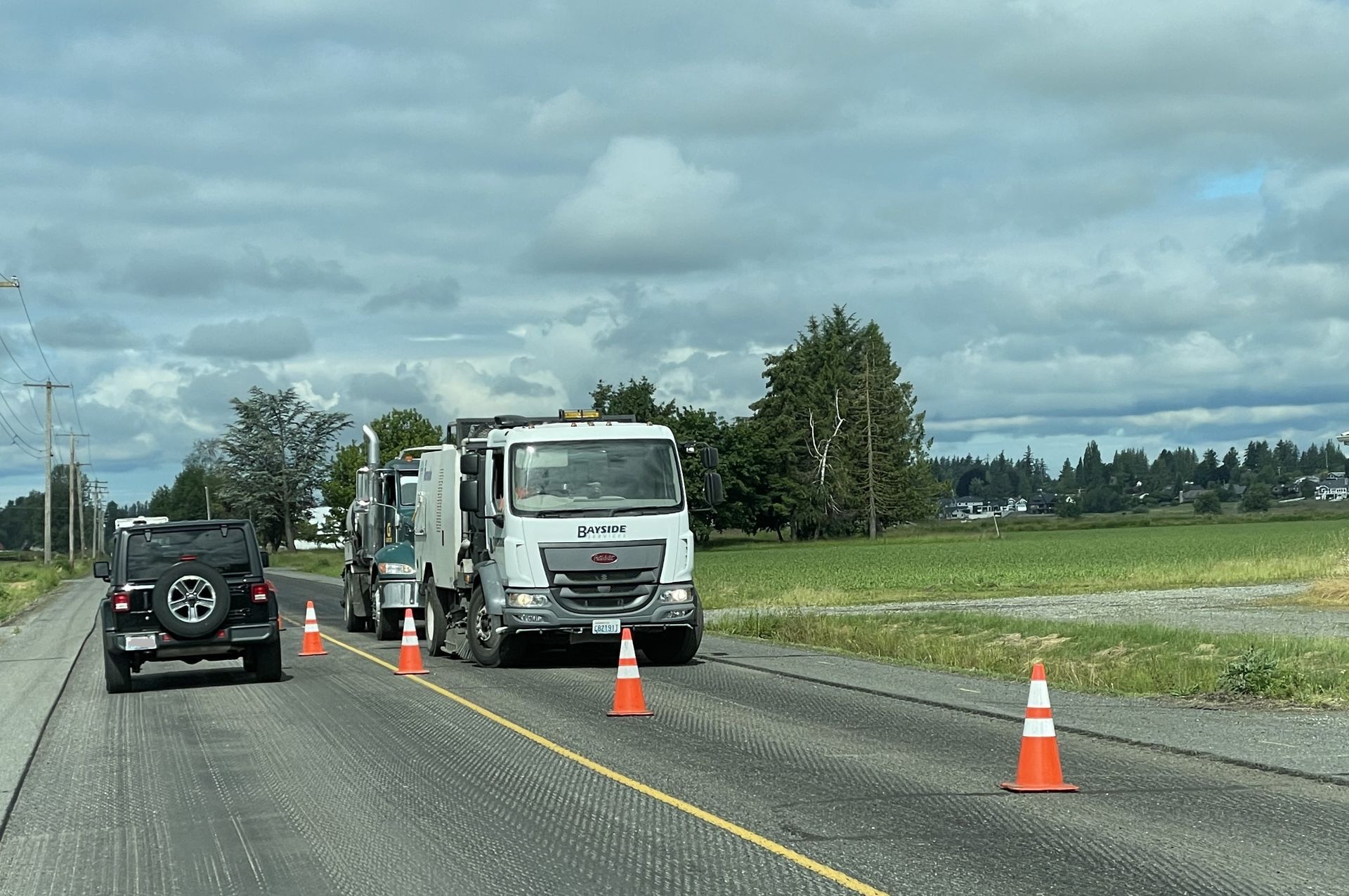 Industrial Vacuuming — Truck On Road Construction Site in Everson, WA