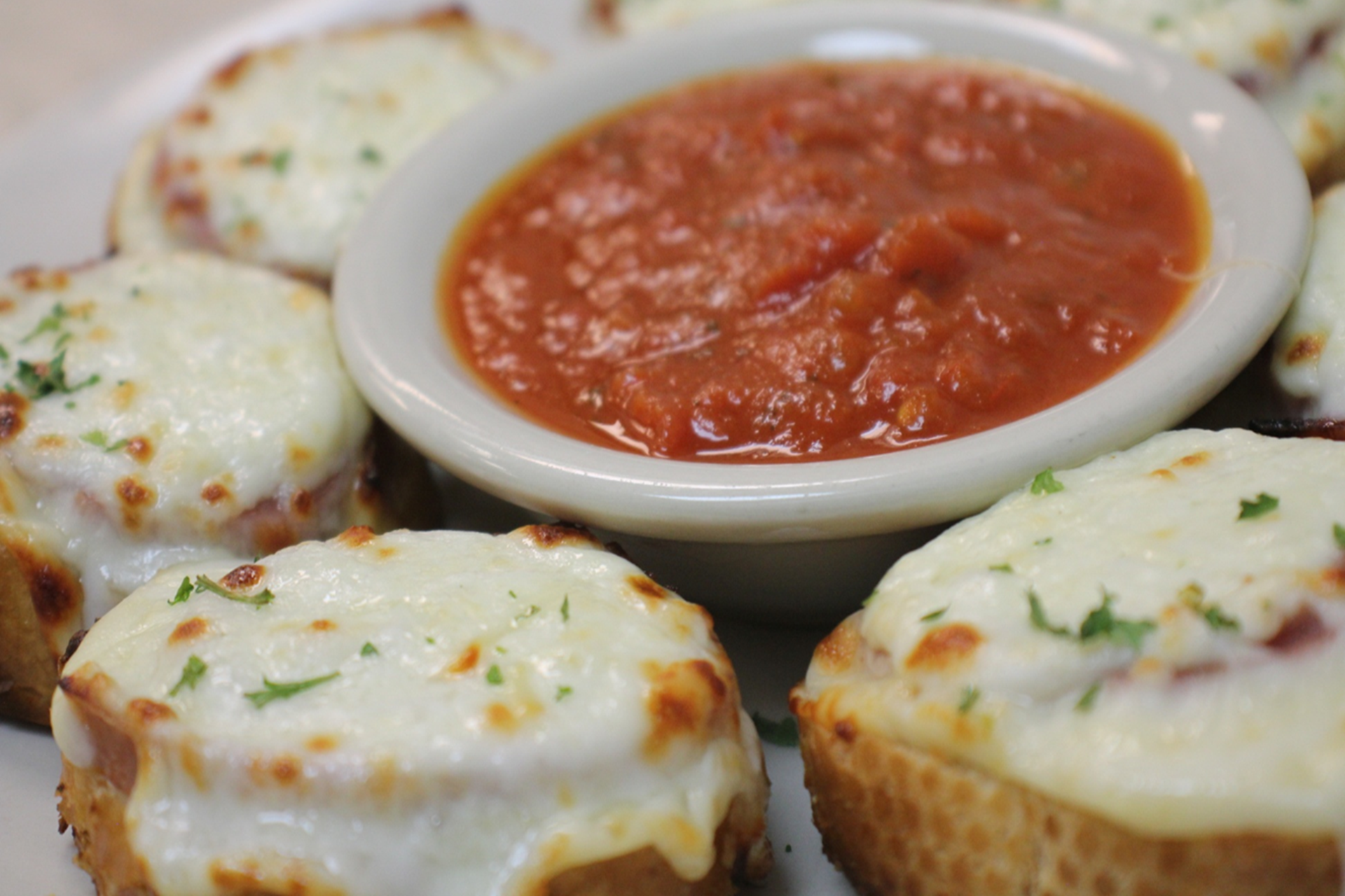 Crostini topped with Antipasto meats and cheese. served with marinara sauce.
