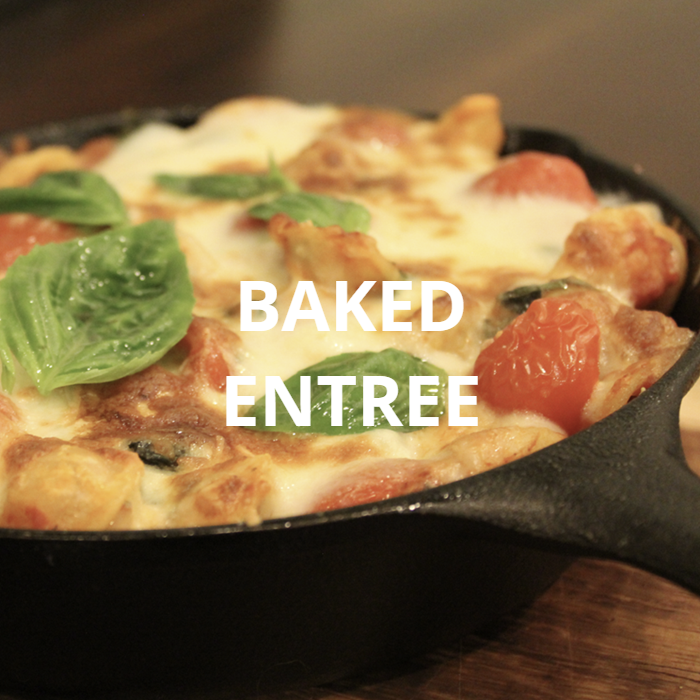 A delicious baked penne pasta dish featuring ripe tomatoes, fragrant basil, and fresh mozzarella cheese. The golden-brown top layer and melted cheese, combined with the vibrant colors of the tomatoes and basil, create a visually appealing and mouthwatering meal.