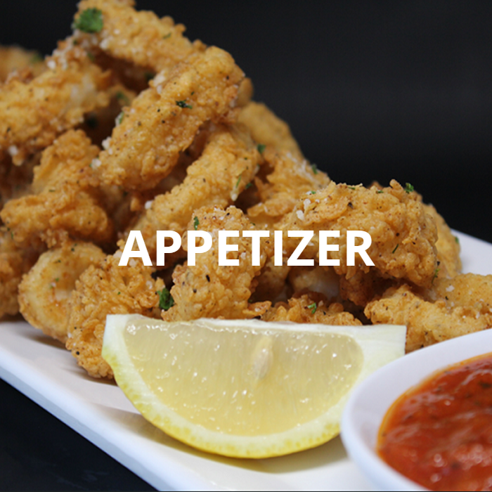 A plate of golden, crispy fried calamari served with a side of tangy marinara sauce and a fresh slice of lemon for garnish. The perfectly cooked calamari rings are lightly breaded, showcasing a mouthwatering, crunchy texture.