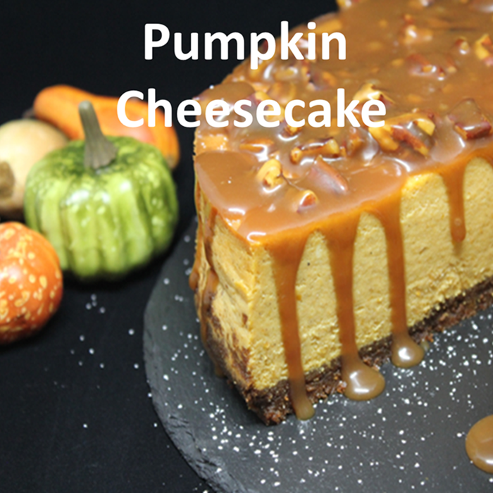 Pumpkin Cheesecake with Bourbon Pecan Caramel Sauce