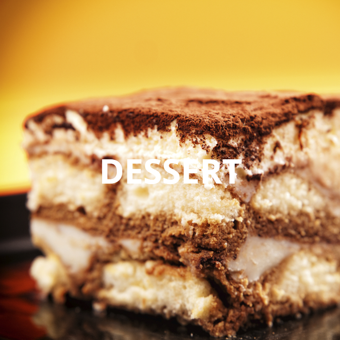 A decadent tiramisu dessert featuring layers of ladyfingers soaked in rich espresso, topped with creamy mascarpone cheese and a dusting of cocoa powder. The beautifully layered and indulgent dessert is a visually appealing and mouthwatering treat