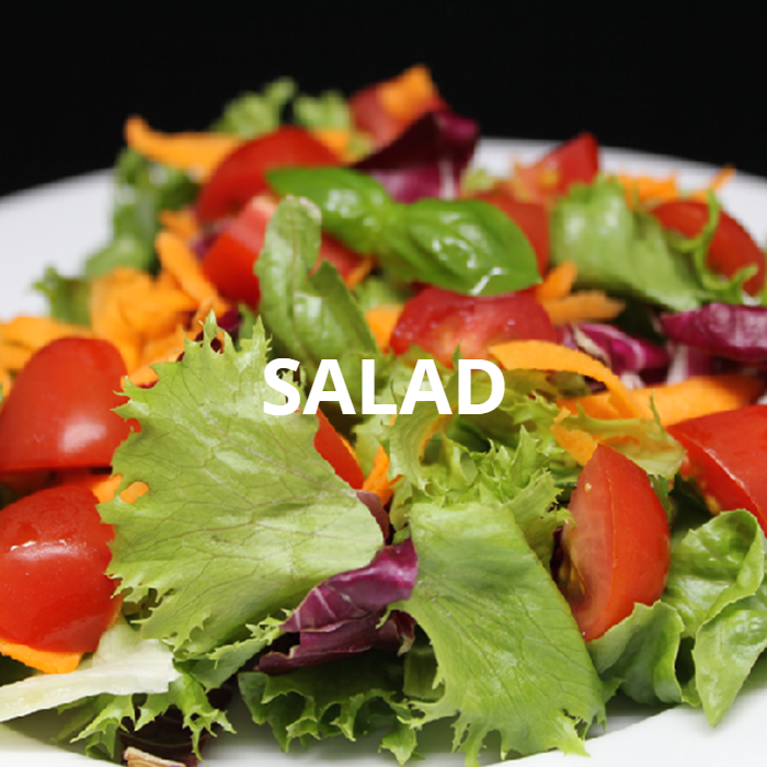 A fresh and vibrant salad featuring crisp lettuce, crunchy red cabbage, shredded carrots, and juicy tomato wedges. The colorful assortment of vegetables creates a visually appealing and healthy dish, perfect for a light meal or a refreshing side.