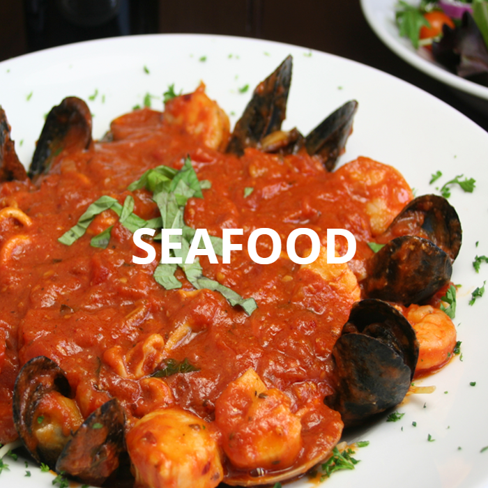 A delectable assortment of seafood including plump shrimp, tender mussels, succulent scallops, flavorful crab meat, and fresh clams, all served in a rich and savory marinara sauce over perfectly cooked linguine pasta. The vibrant colors and textures of the seafood, combined with the aromatic sauce, make this dish a visually stunning and mouthwatering culinary delight