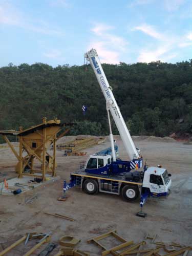 Blue crane at construction site — Build Up Crane Hire in Casuarina, NT