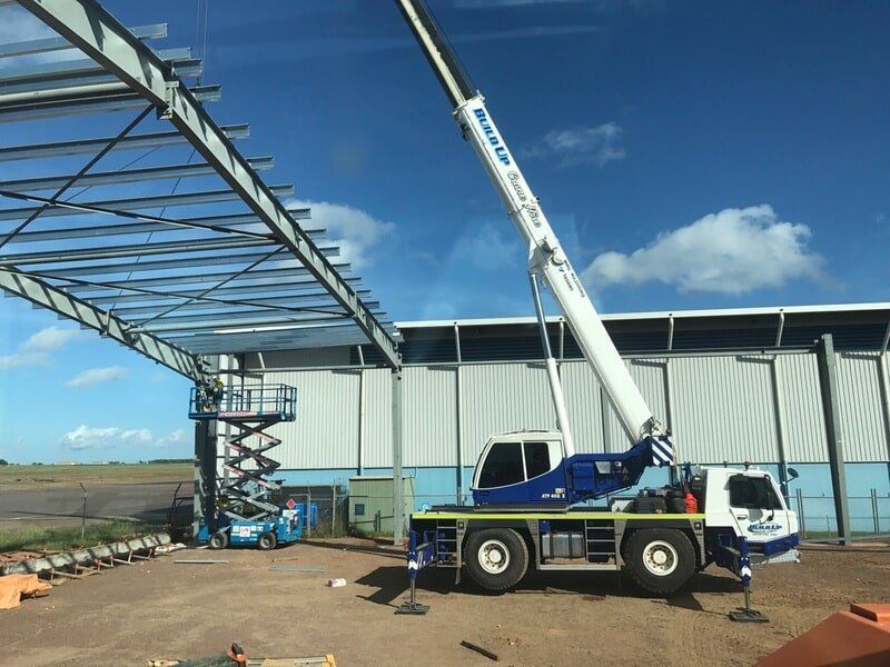 Crane installing steel trusses — Build Up Crane Hire in Casuarina, NT