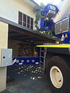 Crane in front of house — Build Up Crane Hire in Casuarina, NT
