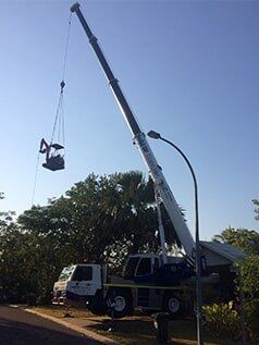 Crane carrying scrap steel — Build Up Crane Hire in Casuarina, NT