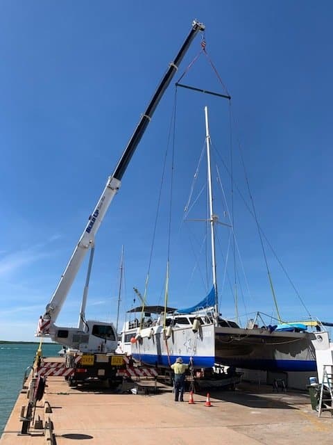 Crane at Port Lifting Boat — Build Up Crane Hire in Casuarina, NT