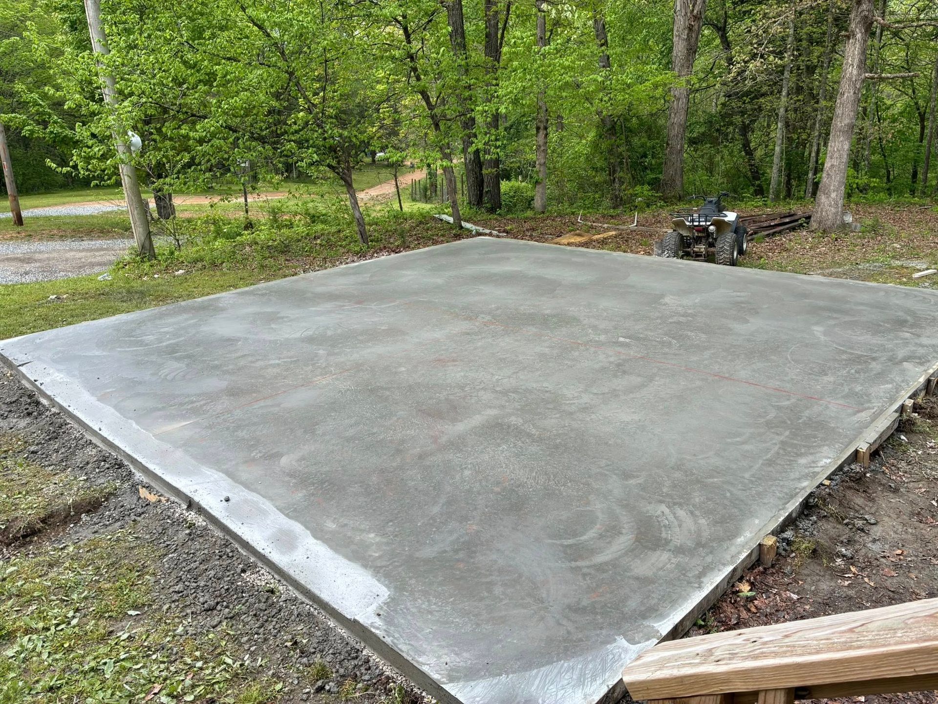Martinez Construction | A concrete floor is being built in the middle of a forest.