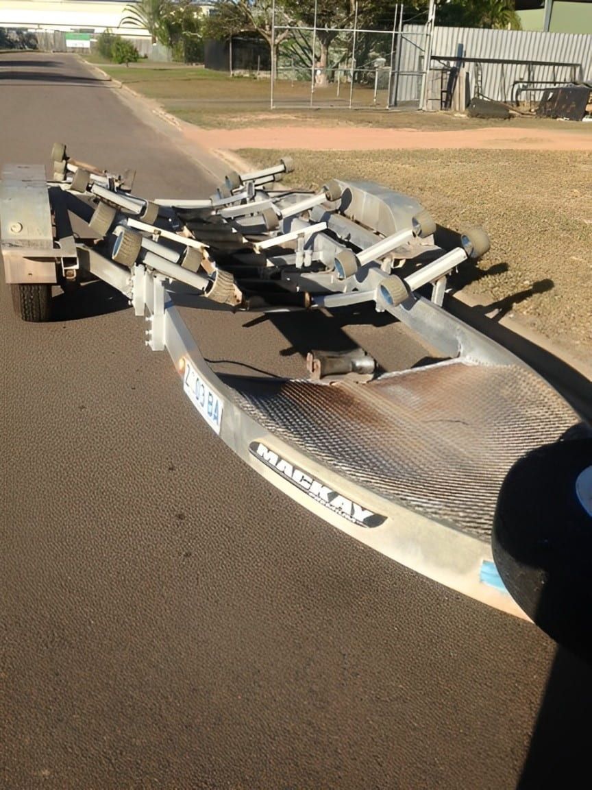A Boat Trailer Is Sitting On The Side Of The Road — Bohle Welding & Trailer Repairs In Bohle, QLD