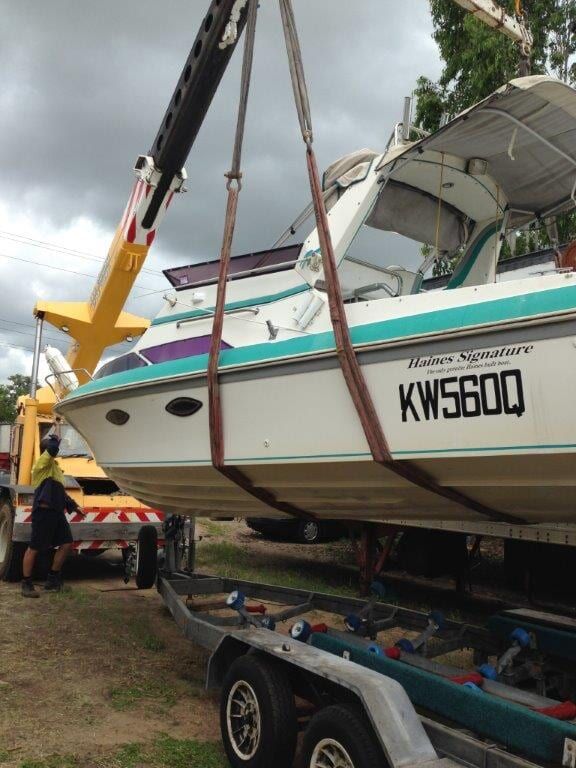 A Boat Is Being Lifted By A Crane — Bohle Welding & Trailer Repairs In Bohle, QLD