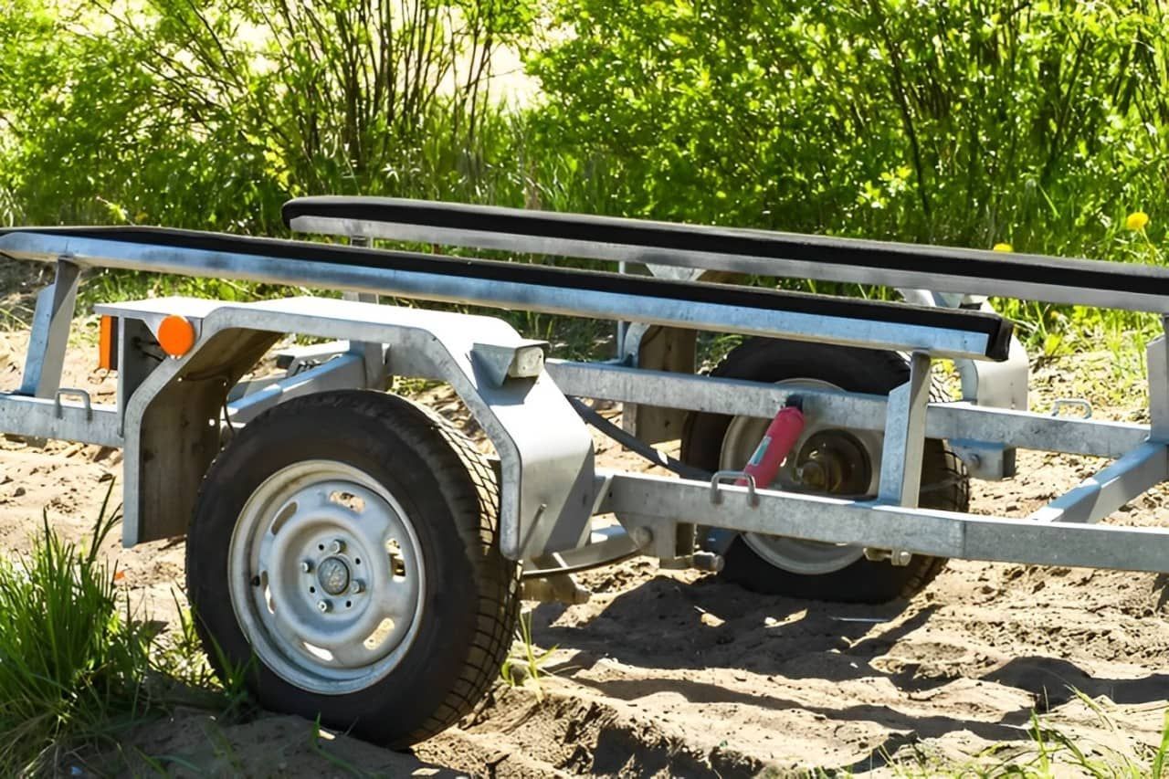 A Boat Trailer Is Parked In The Dirt — Bohle Welding & Trailer Repairs In Bohle, QLD