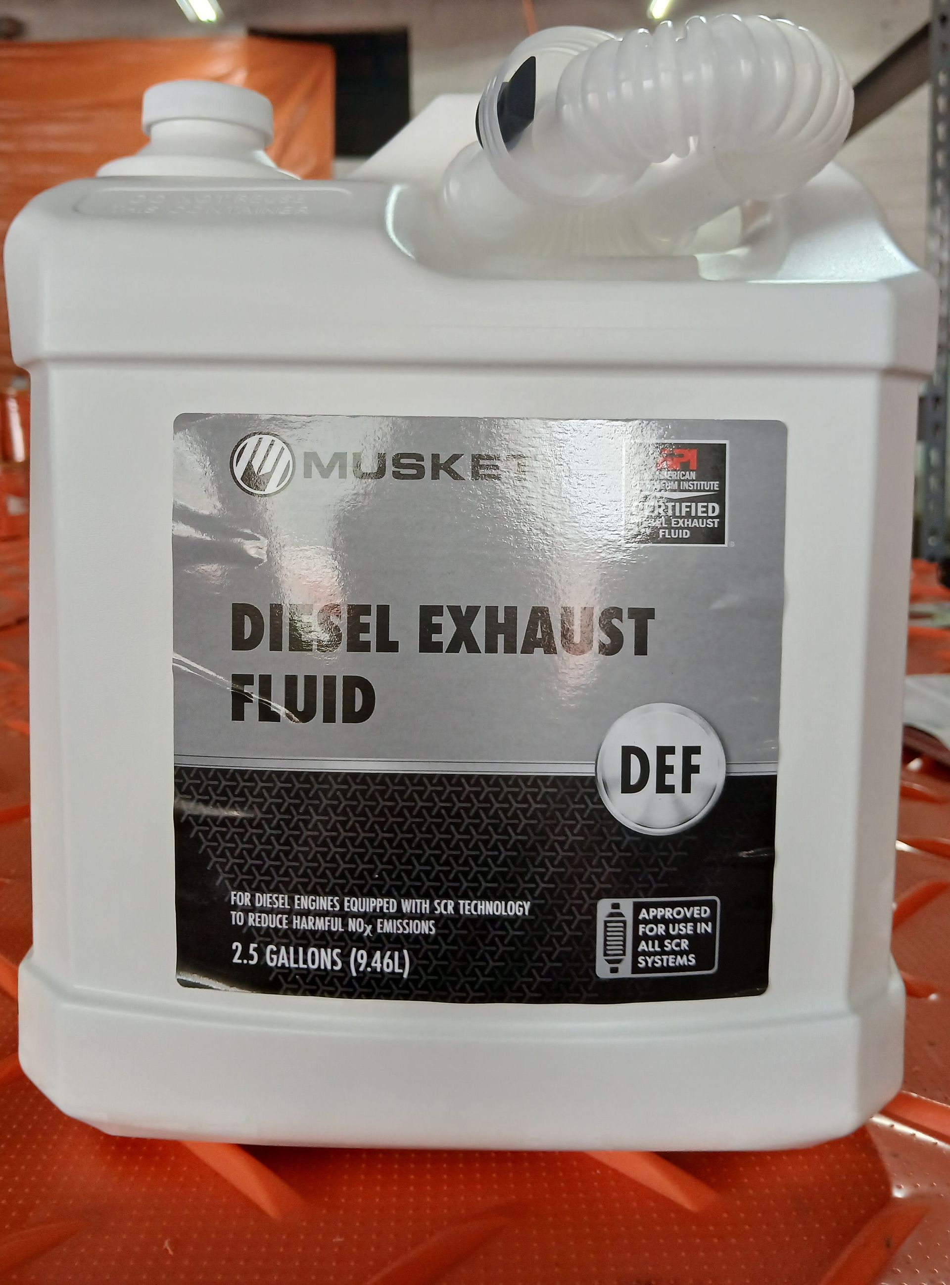White container of Musket Diesel Exhaust Fluid (DEF) with label, 2.5 gallons.