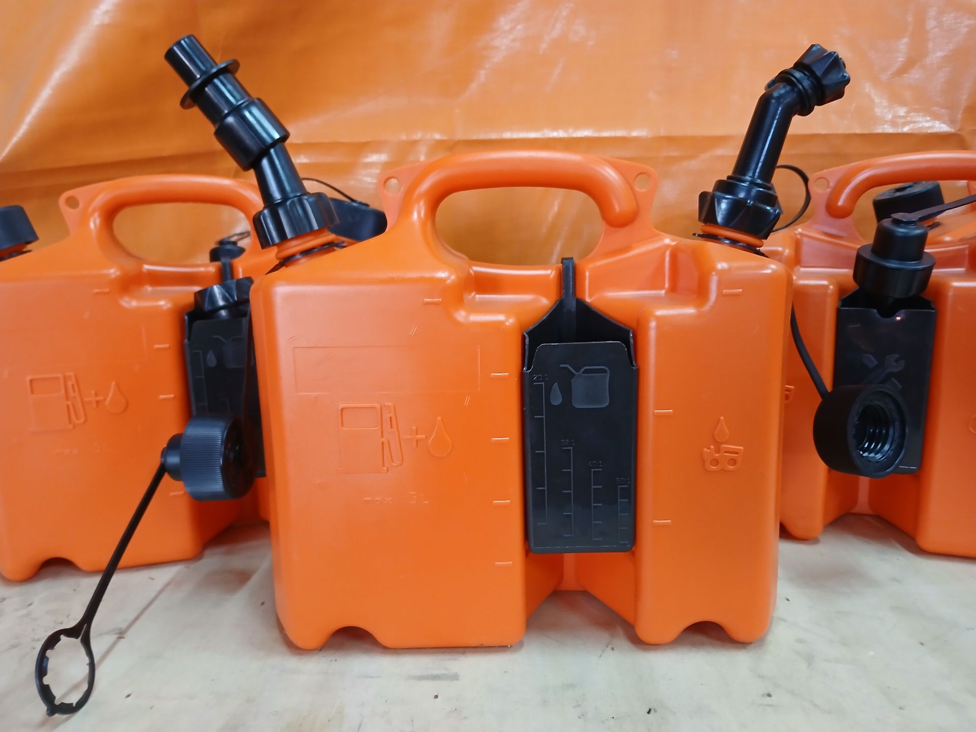 A person is cutting a tree branch with a pair of scissors. A person is cutting a tree branch with a pair of scissors.