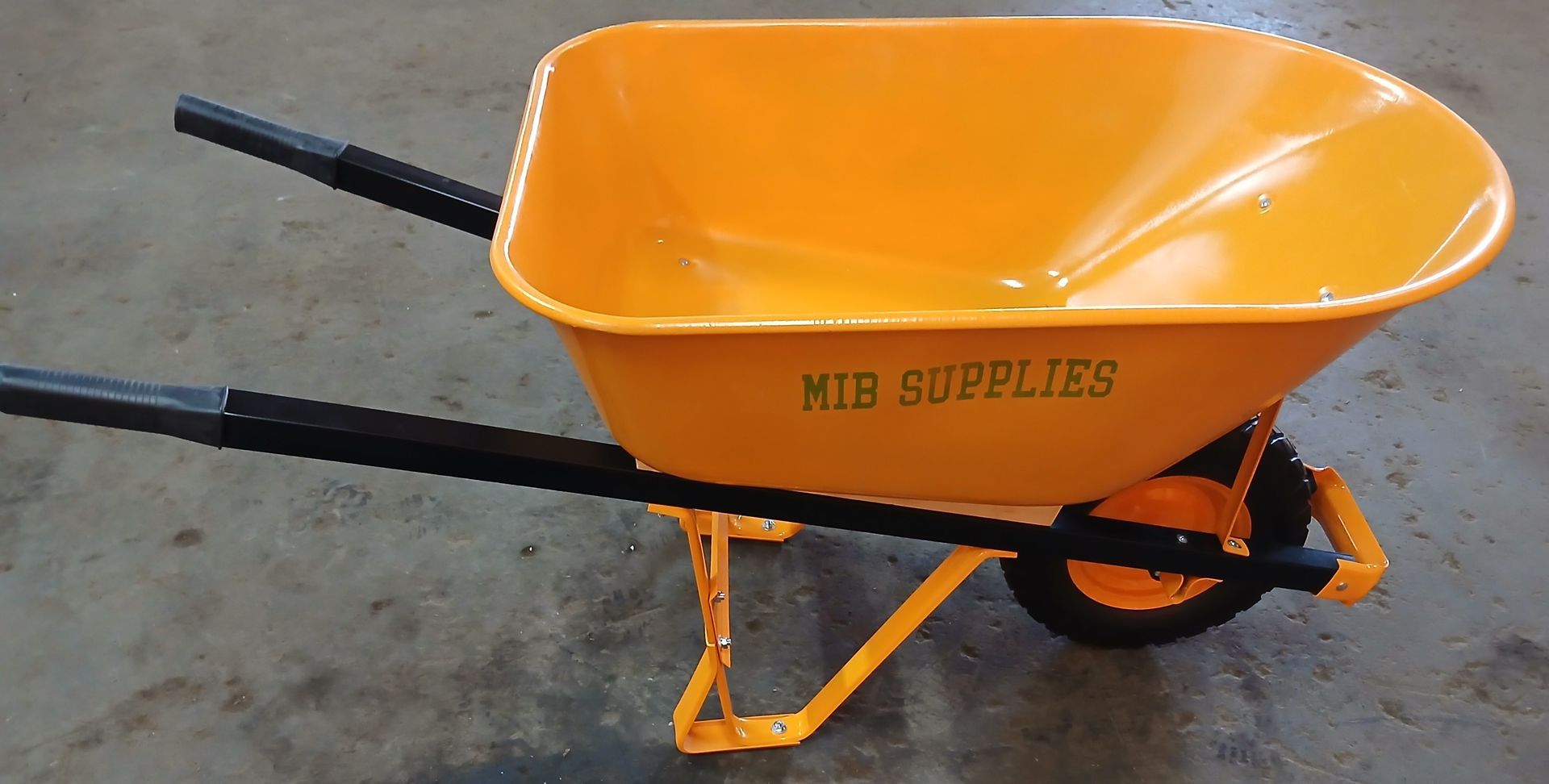 A pair of black and green pruning shears on a white background.