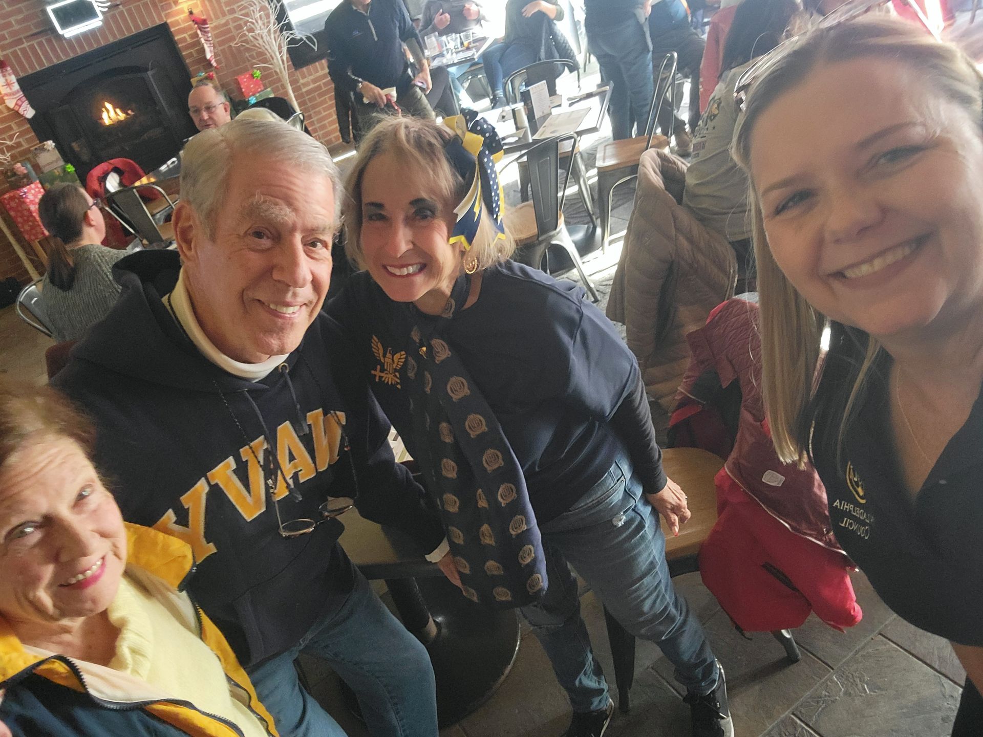 A group of people are posing for a picture in a restaurant