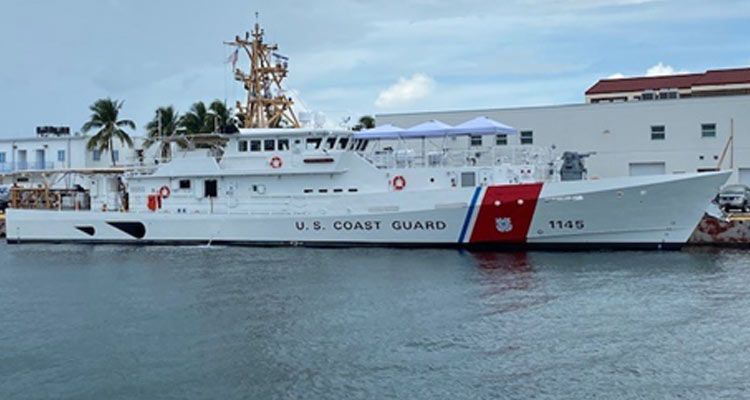 A Large U.S. Coast Guard Boat Is Docked in The Water