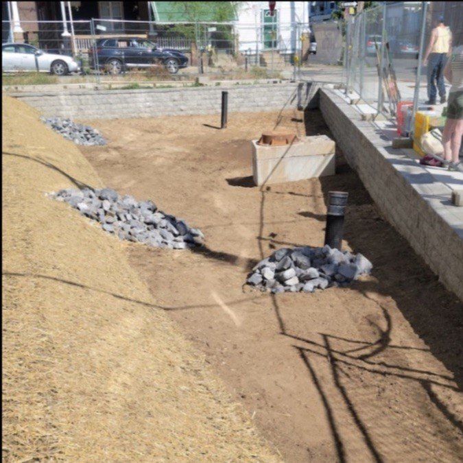 A large pile of dirt and rocks sits on the ground