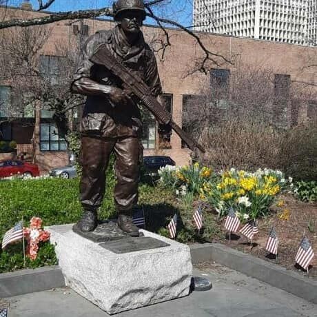 Vietnam veterans memorial with people standing in front of it