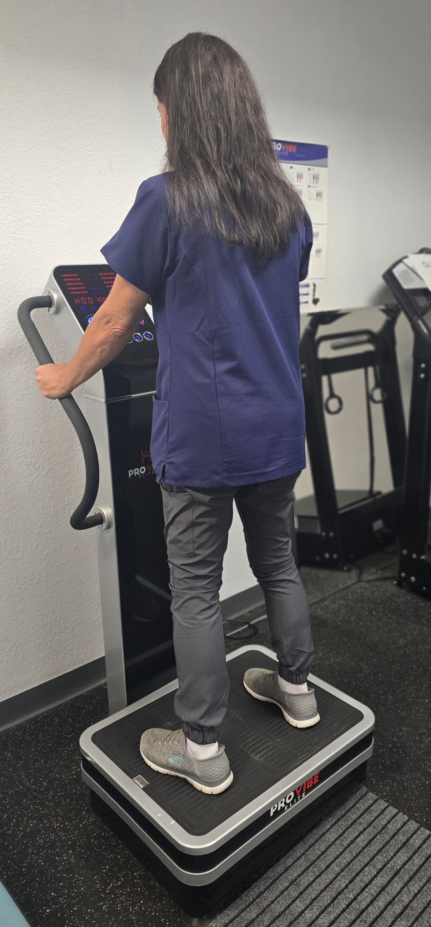 woman in whole body vibration therapy