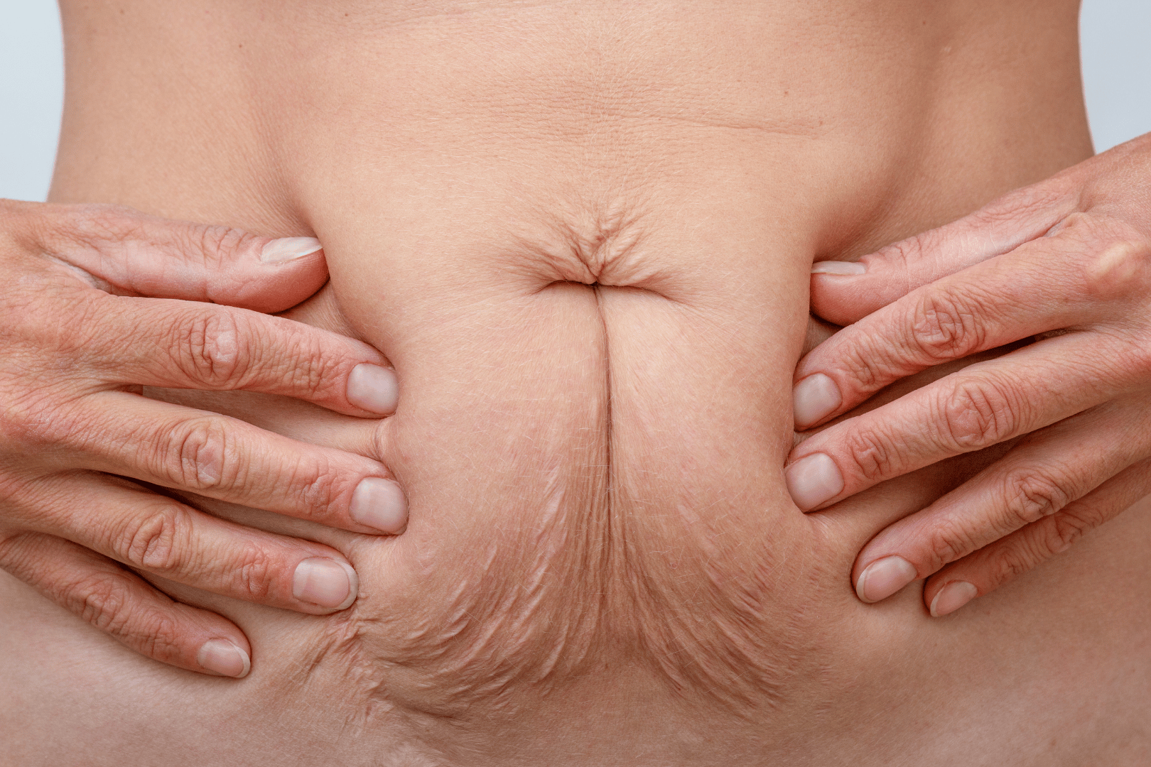 woman holding her stomach