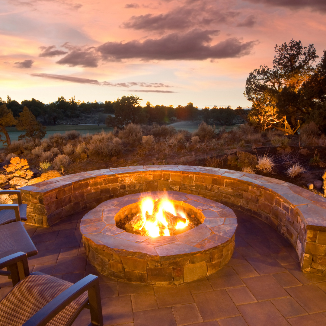 Lit fire pit in a patio at night